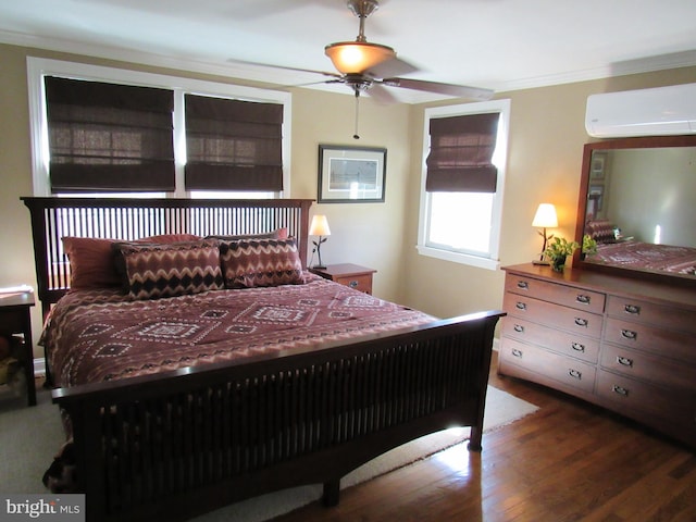 bedroom featuring ornamental molding, a wall mounted AC, ceiling fan, and dark hardwood / wood-style flooring