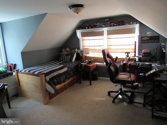 carpeted bedroom with vaulted ceiling