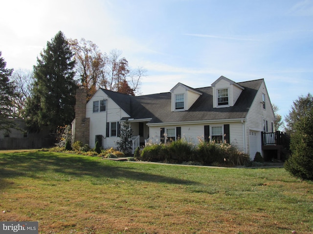 cape cod house with a front lawn