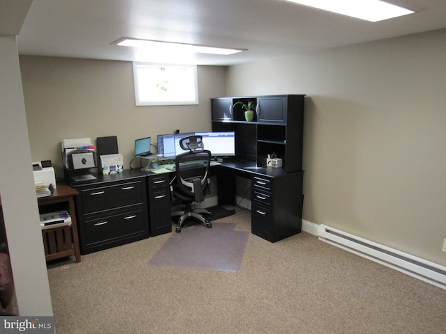 office space with baseboard heating and light colored carpet