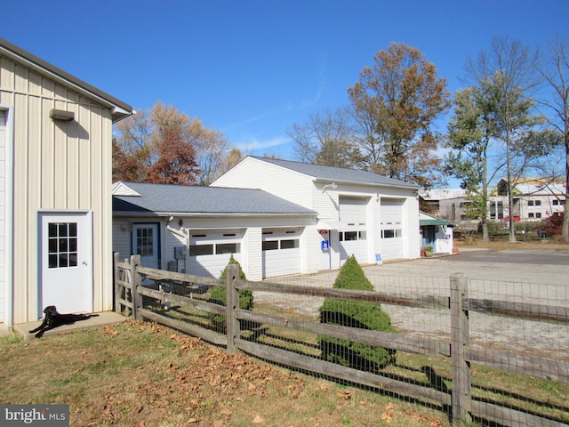 view of property exterior with a garage