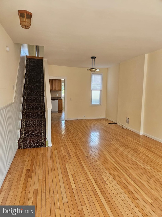 unfurnished living room with light wood-type flooring