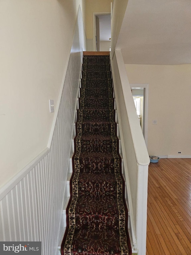 stairway featuring hardwood / wood-style floors