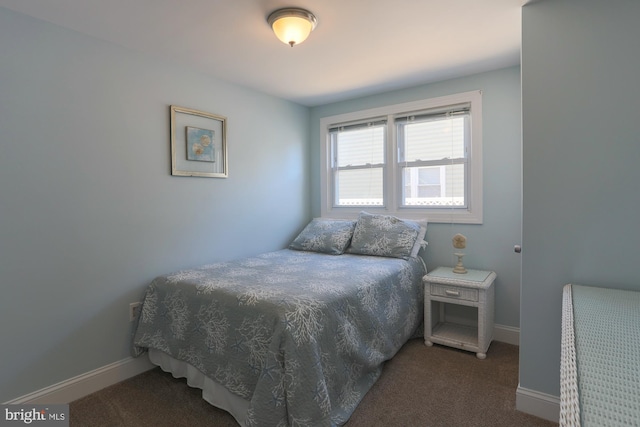 bedroom with dark carpet