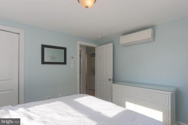 bedroom featuring a wall mounted AC