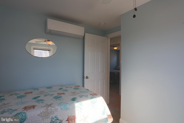 bedroom featuring carpet, an AC wall unit, and ceiling fan