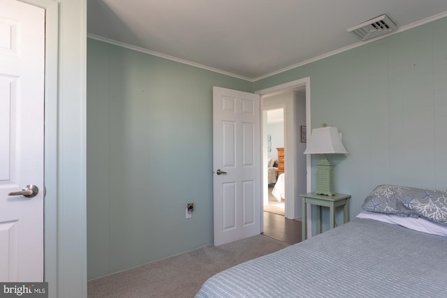 bedroom with light colored carpet and ornamental molding