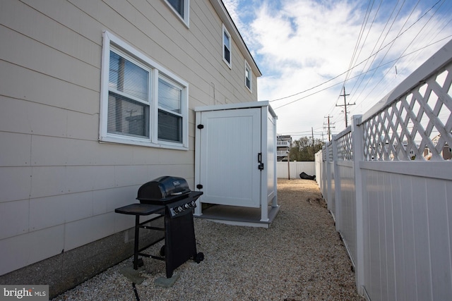 view of home's exterior featuring a storage shed