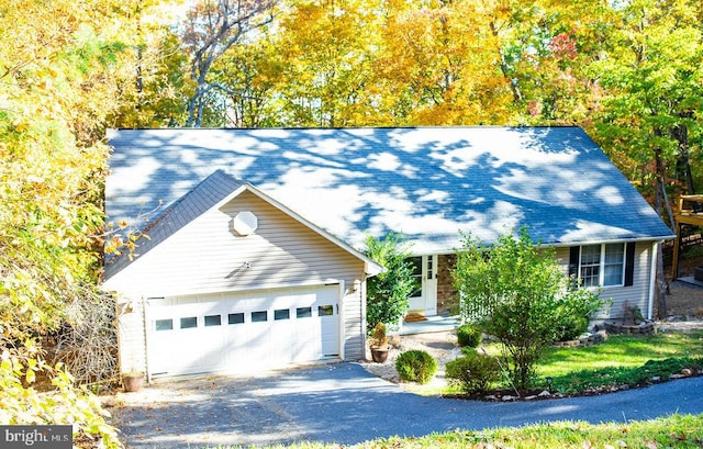 view of front of home featuring an outbuilding and a garage