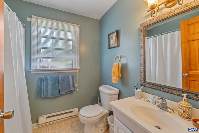 bathroom with toilet, vanity, and a baseboard radiator