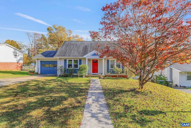 view of front of home featuring a front yard and a garage