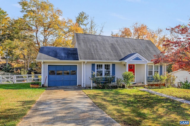 view of front facade with a front yard and a garage