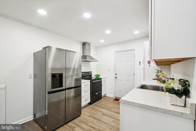 kitchen featuring wall chimney exhaust hood, light hardwood / wood-style flooring, sink, electric range, and stainless steel fridge with ice dispenser