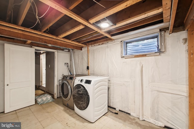 washroom featuring washer and clothes dryer