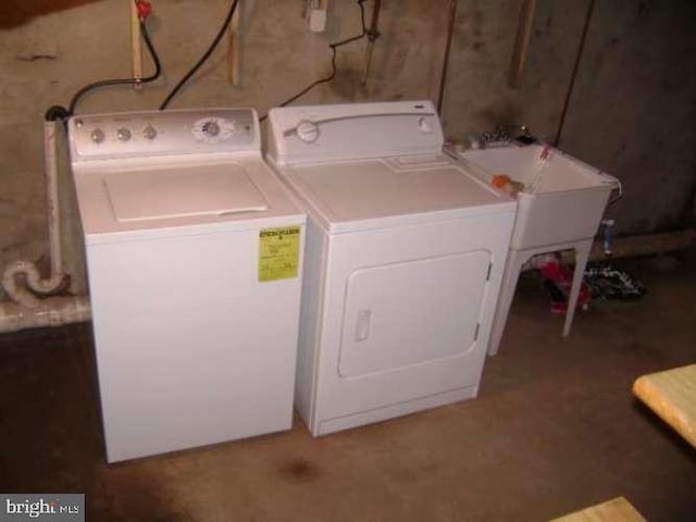 washroom featuring washer and dryer