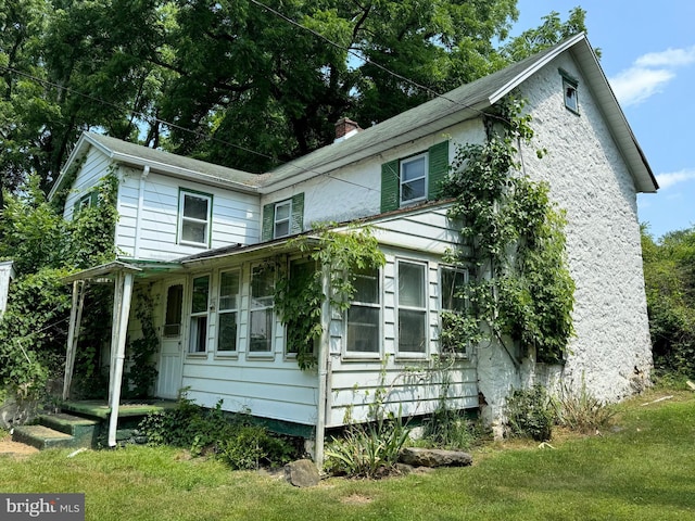 exterior space with a yard