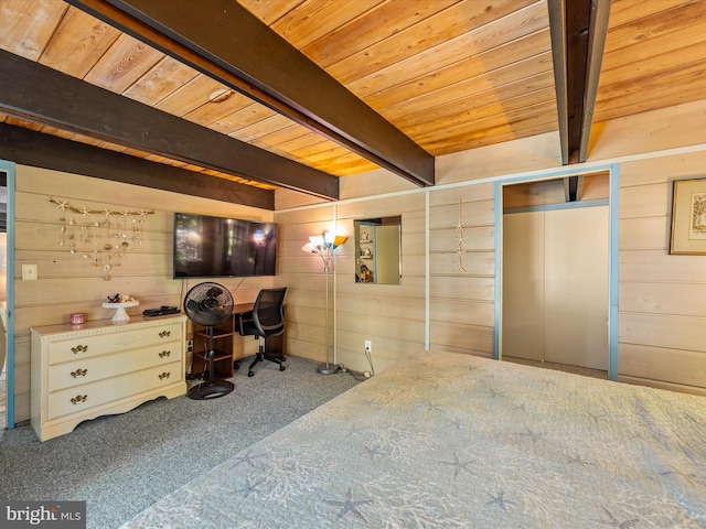 unfurnished bedroom featuring carpet flooring, wood walls, beam ceiling, and wooden ceiling