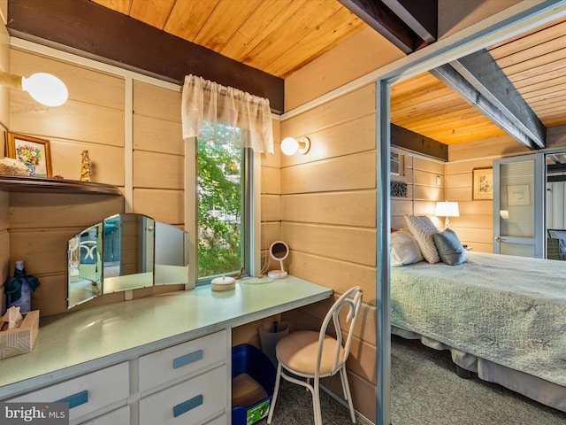 carpeted bedroom featuring beamed ceiling, wood ceiling, and wooden walls