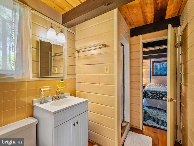 bathroom featuring vanity, wood ceiling, a wealth of natural light, and hardwood / wood-style floors