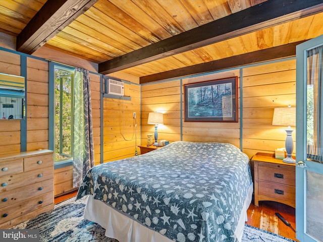 bedroom with beam ceiling, wood walls, hardwood / wood-style flooring, and wooden ceiling