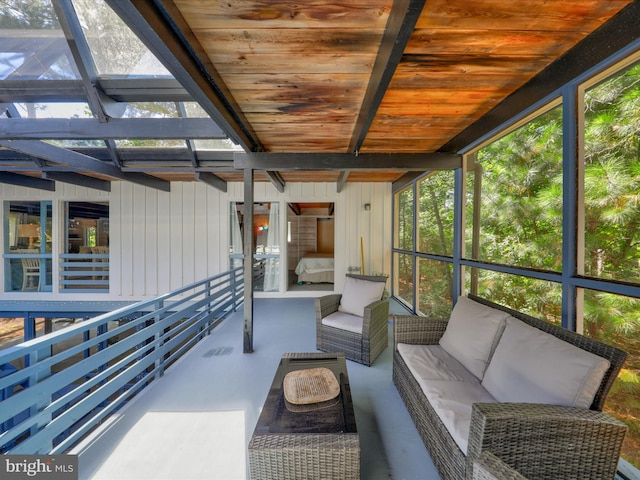 sunroom / solarium featuring wooden ceiling