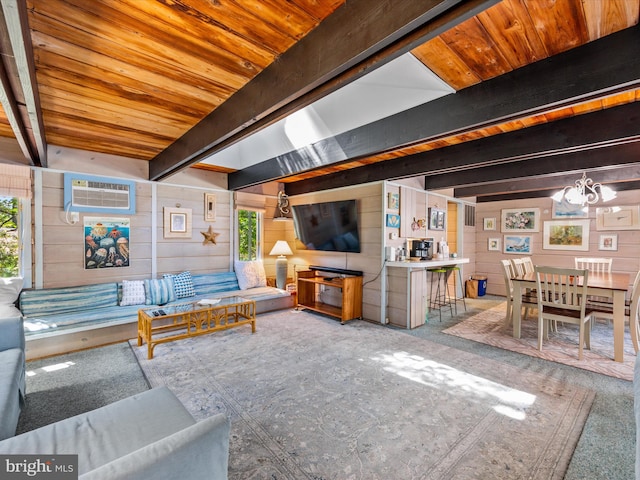 living room with wood ceiling, carpet flooring, wood walls, beamed ceiling, and an AC wall unit