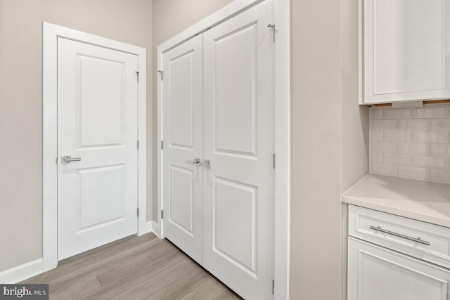 hallway featuring light hardwood / wood-style flooring