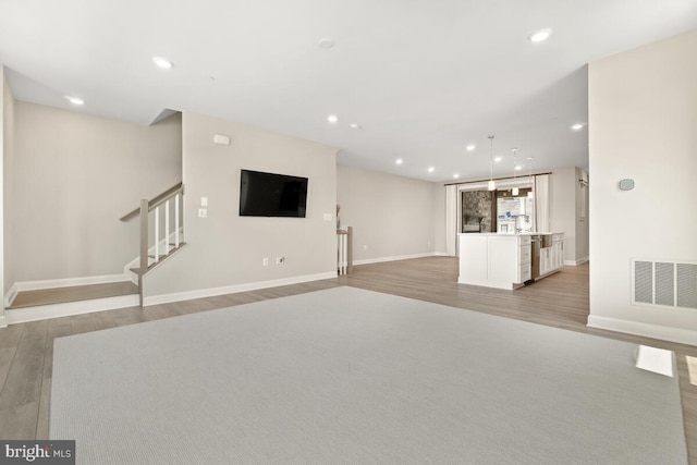 unfurnished living room featuring light wood-type flooring