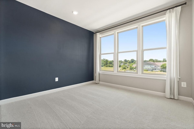 empty room featuring carpet flooring