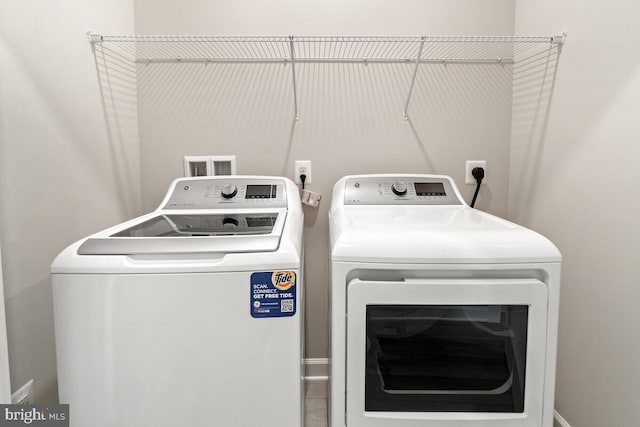 laundry area featuring washing machine and dryer