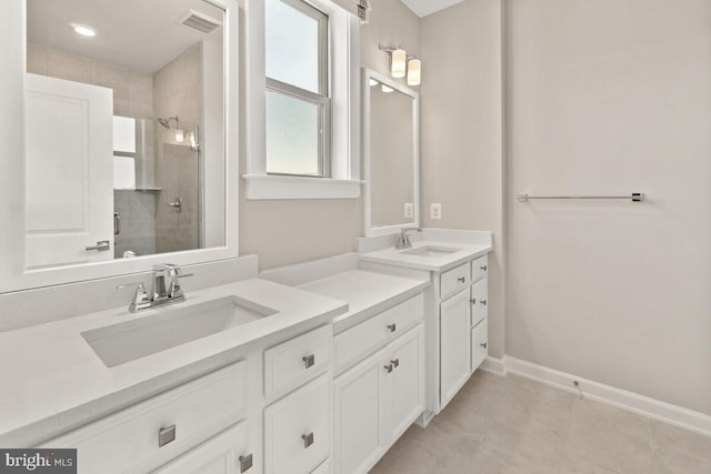 bathroom featuring vanity, tile patterned floors, and an enclosed shower