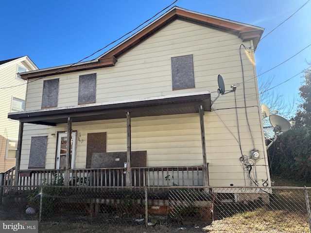 back of house with a porch