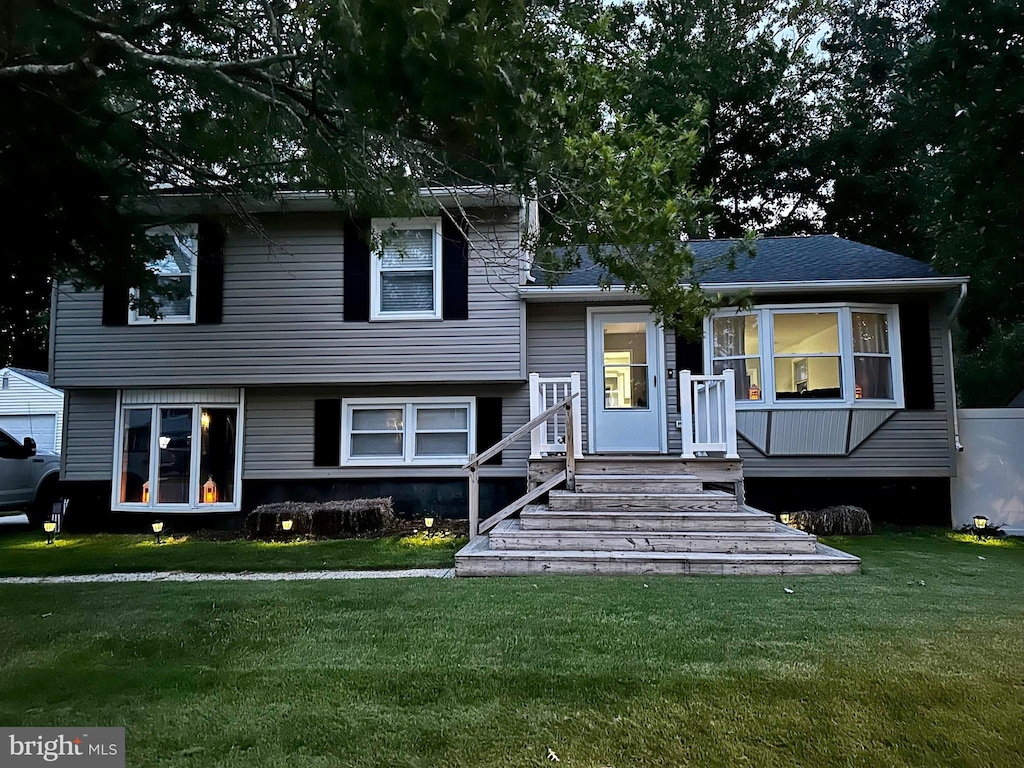 split level home with a front yard