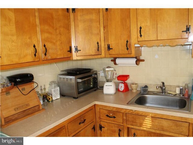 kitchen with sink and backsplash