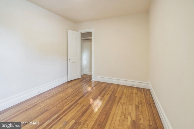 unfurnished room featuring hardwood / wood-style floors