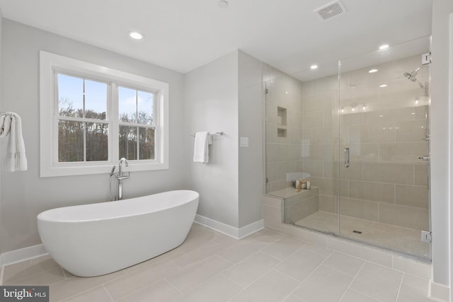 bathroom featuring shower with separate bathtub and tile patterned floors