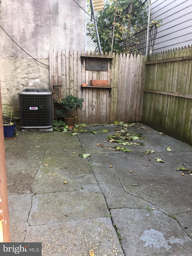 view of patio with central AC