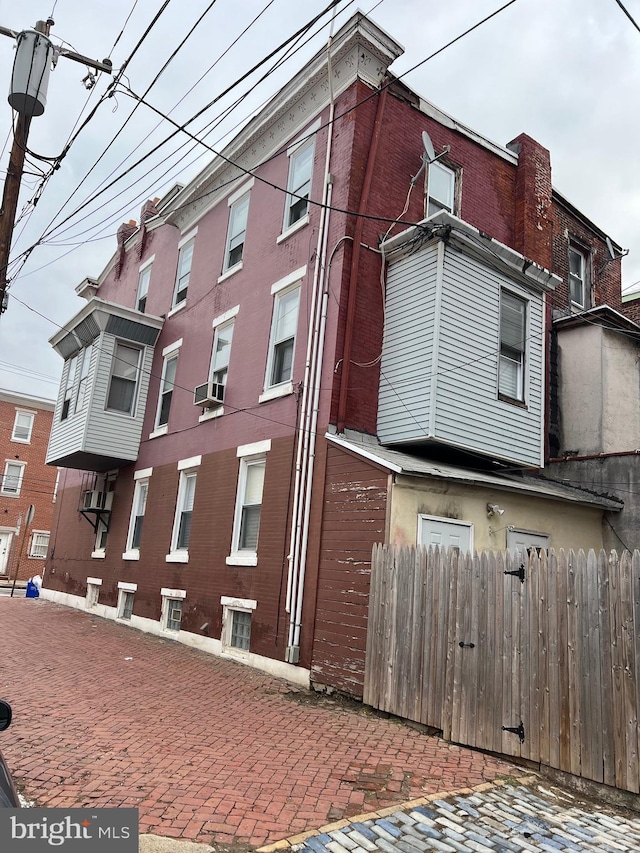 view of building exterior with cooling unit