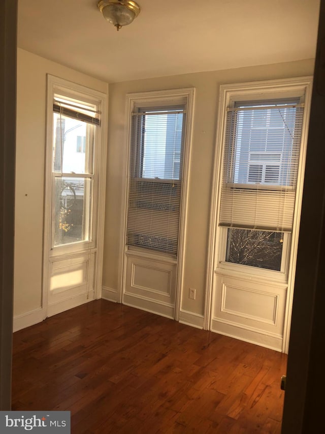 doorway to outside featuring dark hardwood / wood-style floors and plenty of natural light