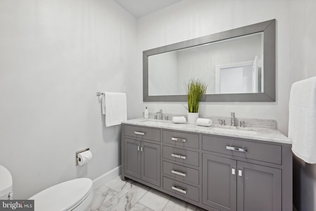 bathroom with toilet and vanity