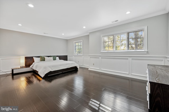 bedroom featuring dark hardwood / wood-style floors and crown molding