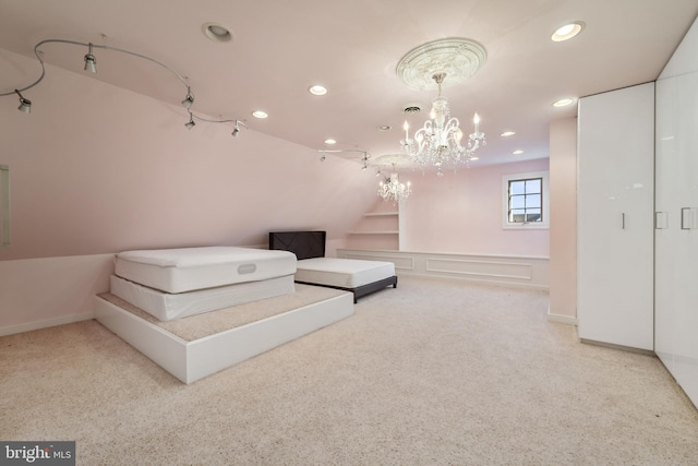 carpeted bedroom with a chandelier