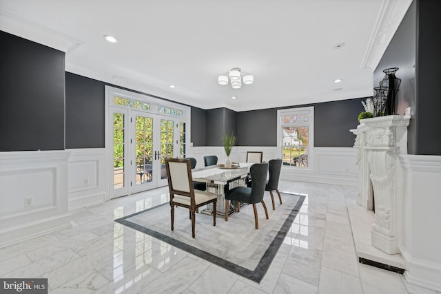 dining space featuring crown molding and french doors