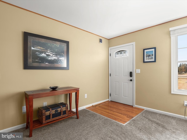 view of carpeted foyer