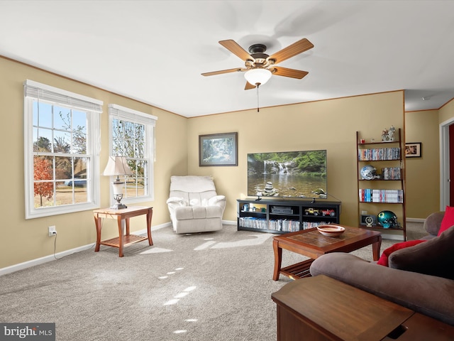 carpeted living room featuring ceiling fan