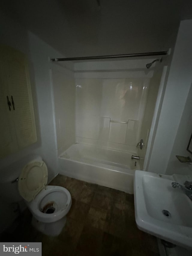 full bathroom with toilet, shower / tub combination, and sink