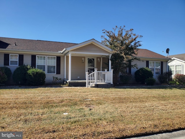 single story home featuring covered porch and a front lawn