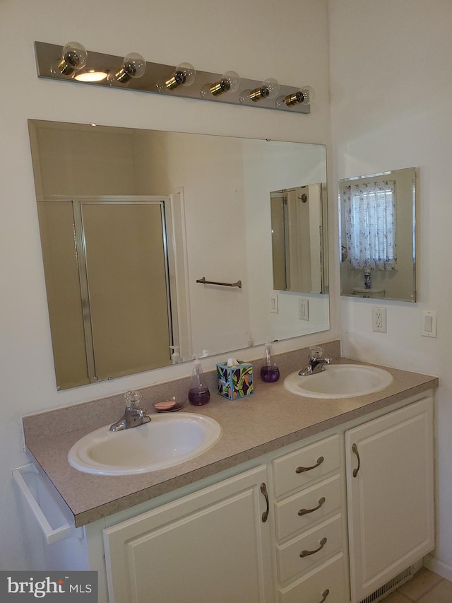 bathroom featuring vanity and walk in shower