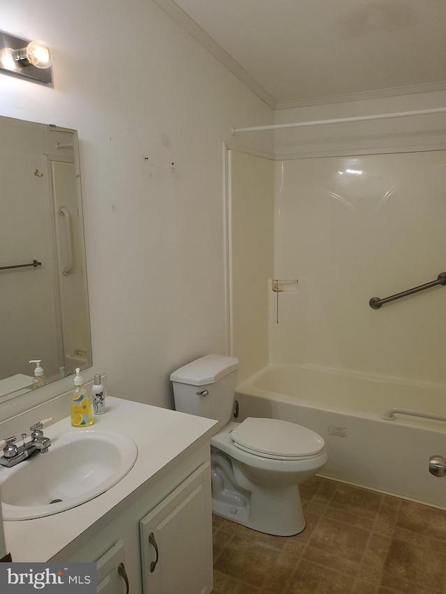 full bathroom with vanity, washtub / shower combination, ornamental molding, and toilet