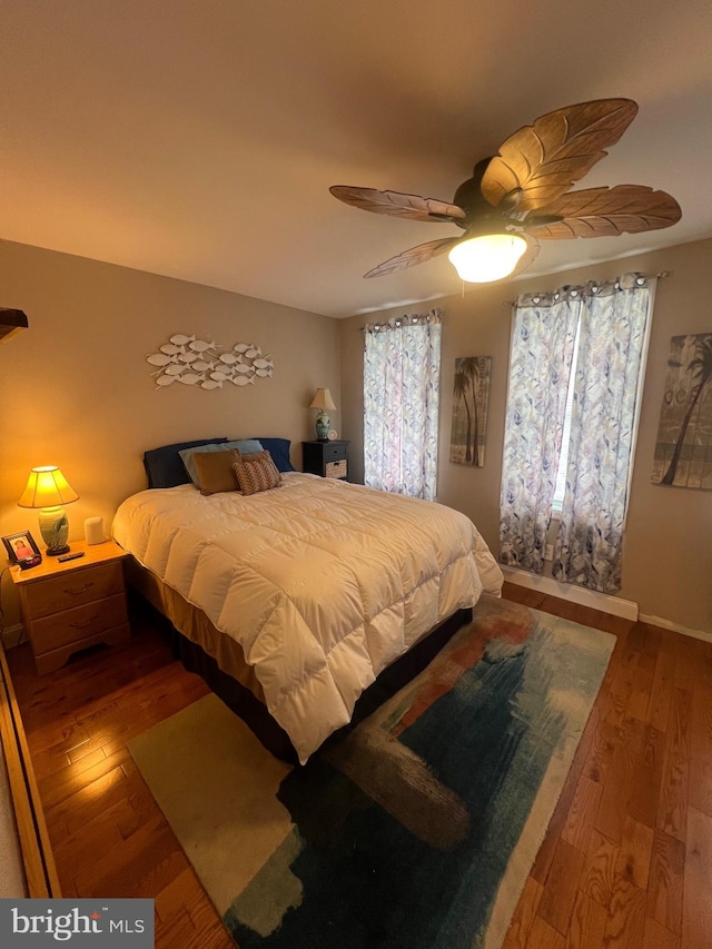 bedroom featuring hardwood / wood-style flooring and ceiling fan